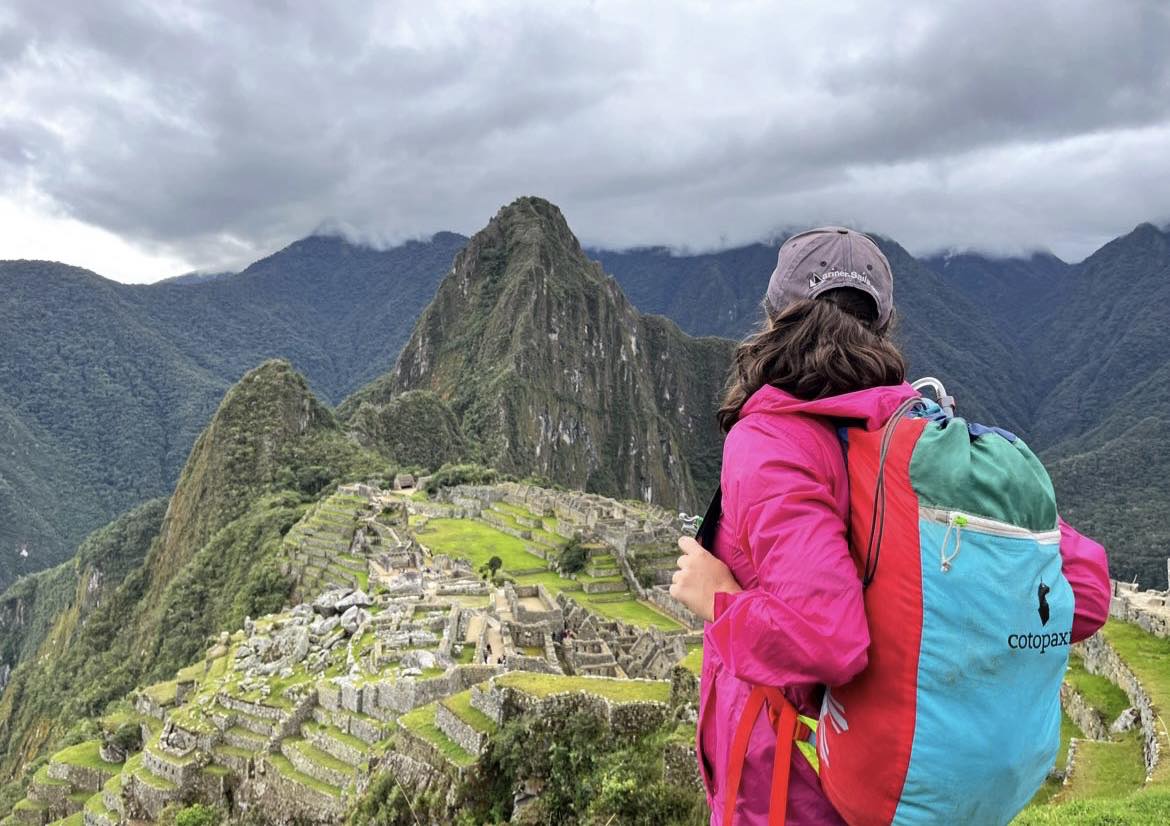 A woman looks at the ruins of Machu Picchu in Peru.